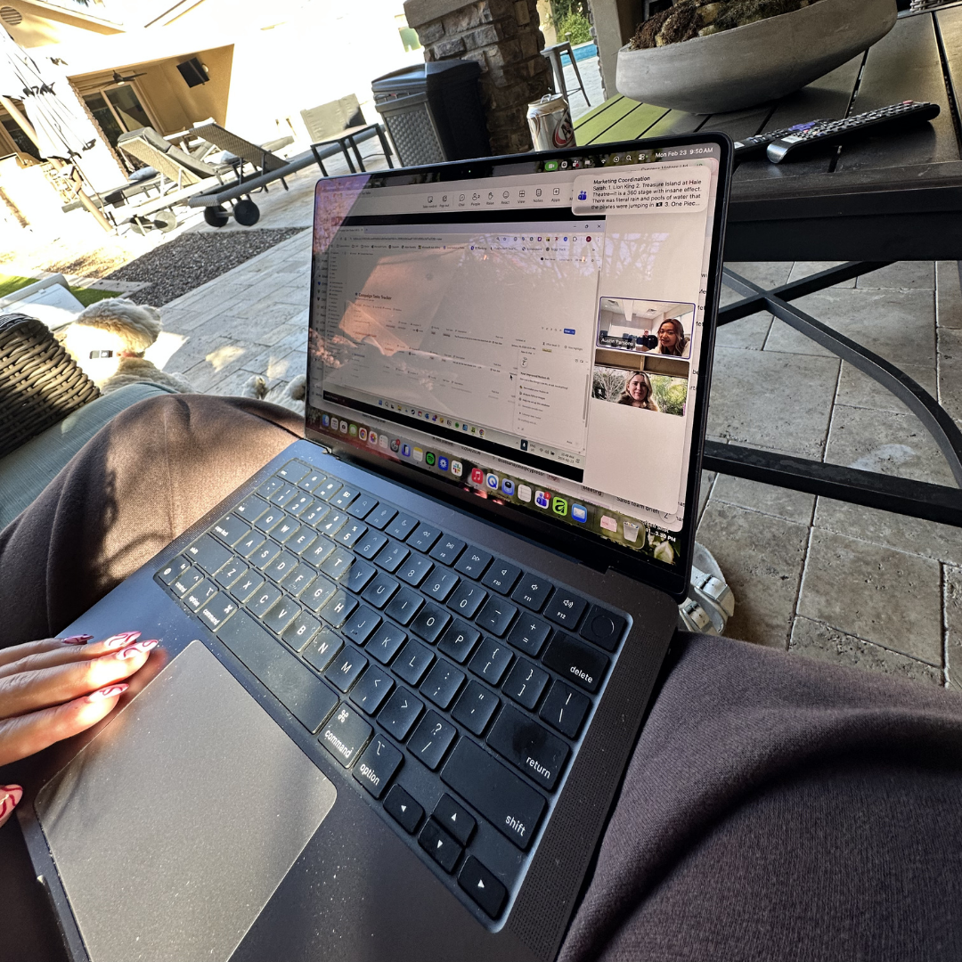 Freelance marketer working on a laptop outdoors, reviewing LinkedIn and content strategy while building a client base